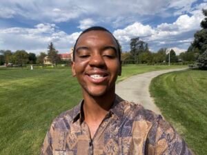 Professional Headshot of a smiling male outside business professional wearing dress shirt